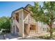 Multi-level apartment building with stone accents and wooden railings on balconies at 9911 E Idaho Cir # 202, Denver, CO 80247