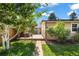 Private backyard retreat with patio, seating, and lush landscaping, perfect for relaxation at 1380 Magnolia St, Denver, CO 80220