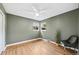 Cozy bedroom with hardwood floors, neutral walls, ceiling fan, and bright windows at 1380 Magnolia St, Denver, CO 80220