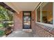 Charming brick home featuring a classic front door and ample natural light at 1380 Magnolia St, Denver, CO 80220