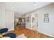 Spacious hallway connecting the bedroom and bathroom, showcasing hardwood floors and modern design elements at 1380 Magnolia St, Denver, CO 80220