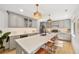 Contemporary kitchen with quartz countertops, stainless steel appliances, and a breakfast bar at 1380 Magnolia St, Denver, CO 80220