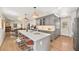 Open kitchen with a quartz island, gray cabinets, and stainless steel appliances for modern living and entertaining at 1380 Magnolia St, Denver, CO 80220