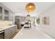 Beautiful kitchen featuring stainless appliances, quartz countertops and modern pendants at 1380 Magnolia St, Denver, CO 80220