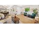 Open-concept living area with bright ambiance, hardwood floors, and elegant furniture at 1380 Magnolia St, Denver, CO 80220