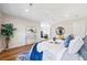 Bright and inviting main bedroom featuring a plush bed, hardwood floors, and stylish décor at 1380 Magnolia St, Denver, CO 80220