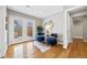 Cozy sitting room with stylish furniture, natural light, and access to the outdoors through French doors at 1380 Magnolia St, Denver, CO 80220