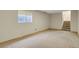 Finished basement provides extra living space with neutral carpet, window, and easy stair access at 15323 E Louisiana Ave, Aurora, CO 80017