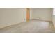 Spacious basement bedroom with carpet floors, large window, and neutral walls at 15323 E Louisiana Ave, Aurora, CO 80017