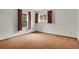 Cozy bedroom featuring carpet flooring and natural light from two windows at 15323 E Louisiana Ave, Aurora, CO 80017