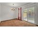 Dining room with sliding glass door leading to backyard and chandelier at 15323 E Louisiana Ave, Aurora, CO 80017