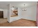 Open dining area with view of kitchen and neutral walls at 15323 E Louisiana Ave, Aurora, CO 80017