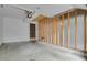 Spacious garage with door to outside with concrete flooring, ready for parking and storage at 15323 E Louisiana Ave, Aurora, CO 80017