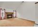 Bright living room featuring a cozy fireplace, neutral walls, and natural light at 15323 E Louisiana Ave, Aurora, CO 80017