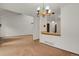 Open-concept living area with view of the kitchen and neutral walls at 15323 E Louisiana Ave, Aurora, CO 80017