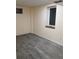 Finished basement with updated flooring, window and electrical outlet at 9852 W 76Th Ave, Arvada, CO 80005
