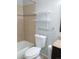Clean bathroom with a shower-tub combo, tiled walls, and a granite vanity at 9852 W 76Th Ave, Arvada, CO 80005