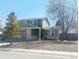 Charming two-story home with a well-manicured lawn and attached garage at 9852 W 76Th Ave, Arvada, CO 80005