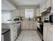 Modern kitchen with stainless steel appliances and ample storage space at 9852 W 76Th Ave, Arvada, CO 80005