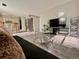 View of living room and kitchen with natural light, hardwood floors and stainless appliances at 9852 W 76Th Ave, Arvada, CO 80005