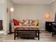 Cozy living room with stylish decor and natural light at 9852 W 76Th Ave, Arvada, CO 80005