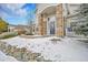 Inviting entrance featuring stone pillars, arched entryway, and a well-maintained walkway with stone retaining wall at 8300 Fairmount Dr # Ff104, Denver, CO 80247