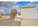 Charming home exterior showcasing the garage and stone accents at 8300 Fairmount Dr # Ff104, Denver, CO 80247