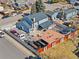 Spacious backyard with a deck, fire pit, trampoline, privacy fence, and plenty of parking spaces at 4620 Blackhawk Way, Denver, CO 80239