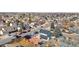Stunning aerial view of the property and surrounding community with mature trees and landscaping at 4620 Blackhawk Way, Denver, CO 80239