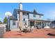 Spacious backyard with brick patio, outdoor seating, barbecue and well-maintained home exterior at 4620 Blackhawk Way, Denver, CO 80239