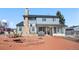 Large backyard with brick patio, fire pit, and outdoor seating, great for entertaining at 4620 Blackhawk Way, Denver, CO 80239