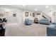 Finished basement featuring additional seating, neutral carpeting, and modern lighting at 4620 Blackhawk Way, Denver, CO 80239