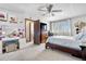Comfortable bedroom featuring white walls, plush carpeting, and a large dresser at 4620 Blackhawk Way, Denver, CO 80239
