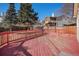 Spacious back deck featuring painted wood and railing overlooking the yard at 19962 E Kent Dr, Aurora, CO 80013