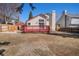 View of a backyard featuring a wooden deck, a small shed, and a fenced perimeter at 19962 E Kent Dr, Aurora, CO 80013