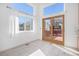 Bright dining area features tile flooring, sliding door access to deck, and lots of natural light from large windows at 19962 E Kent Dr, Aurora, CO 80013