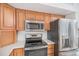 Kitchen showcases modern appliances, including a stainless steel refrigerator and a built-in microwave at 19962 E Kent Dr, Aurora, CO 80013