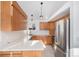 Bright kitchen equipped with stainless steel appliances, ample cabinetry, and a stylish undermount sink at 19962 E Kent Dr, Aurora, CO 80013
