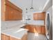 Well-appointed kitchen features ample cabinetry, modern appliances, and a tile floor at 19962 E Kent Dr, Aurora, CO 80013