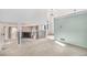 Spacious living room featuring plush carpeting, a balcony, and an inviting fireplace at 19962 E Kent Dr, Aurora, CO 80013