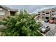 Exterior view of the apartment complex showcasing the building's architecture and surrounding parking area at 7440 S Blackhawk St # 208, Englewood, CO 80112