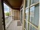 Apartment balcony featuring wood-style flooring and sliding glass doors at 7440 S Blackhawk St # 208, Englewood, CO 80112