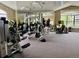 Community fitness center with weight machines and full mirror at 7440 S Blackhawk St # 208, Englewood, CO 80112