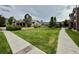 Image showcasing the well-maintained front lawn and landscaping surrounding the residential property at 7440 S Blackhawk St # 208, Englewood, CO 80112