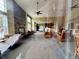 Lobby area with fireplace, seating area and tall windows at 7440 S Blackhawk St # 208, Englewood, CO 80112