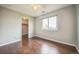 Inviting bedroom with hardwood floors, closet, and a window offering both style and functionality at 2446 S Gibralter Way, Aurora, CO 80013