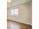 Bedroom with gleaming hardwood floors and natural light creating a serene and inviting ambiance at 2446 S Gibralter Way, Aurora, CO 80013