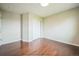 Bright bedroom features hardwood floors and a closet providing a comfortable and stylish space at 2446 S Gibralter Way, Aurora, CO 80013
