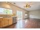 Bright open floorplan connecting the kitchen, dining, and living area and deck access at 2446 S Gibralter Way, Aurora, CO 80013