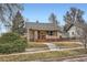 Quaint single-Gathering home boasting mature trees and a cozy covered porch at 2901 Ames St, Wheat Ridge, CO 80214